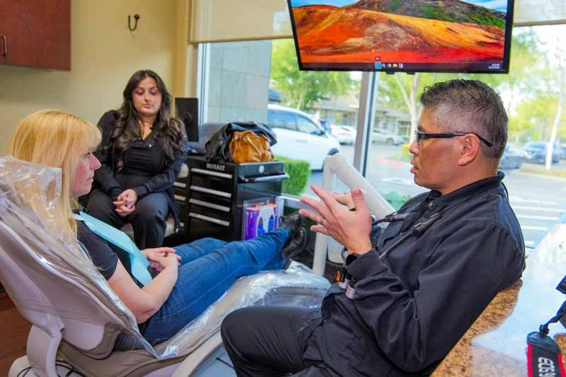 Dr. Kwan discussing cosmetic dentistry treatment