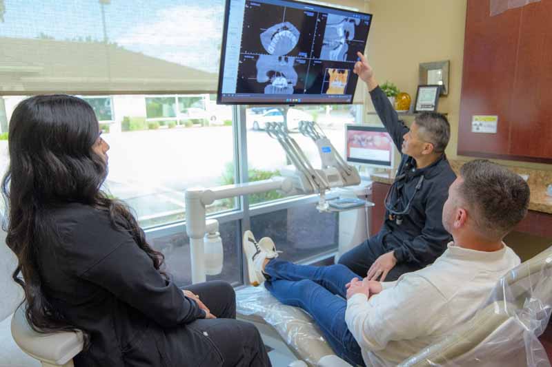 Dr. Kwan showing a patient restorative dentistry options