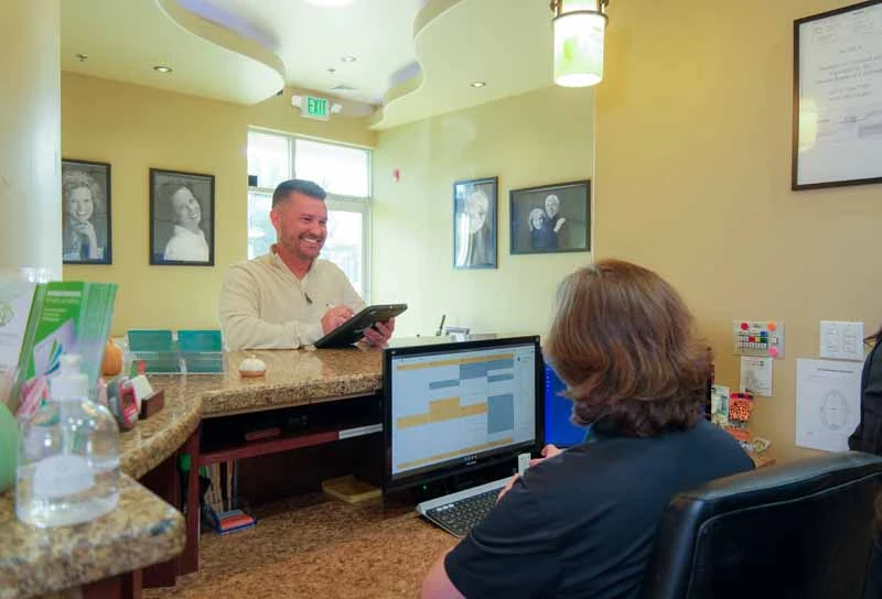 patient paying for services at Nu Smile Roseville Dental